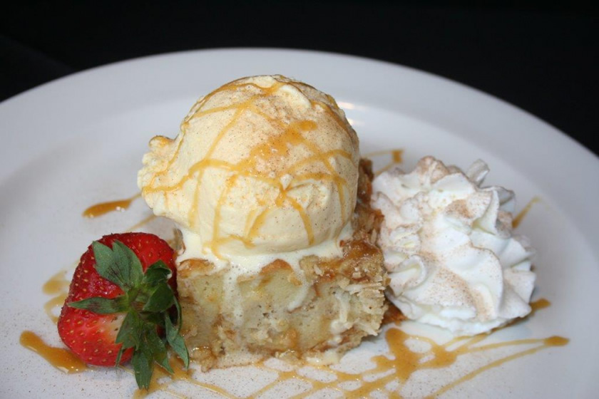 Bread pudding a la mode with ice cream and caramel drizzle