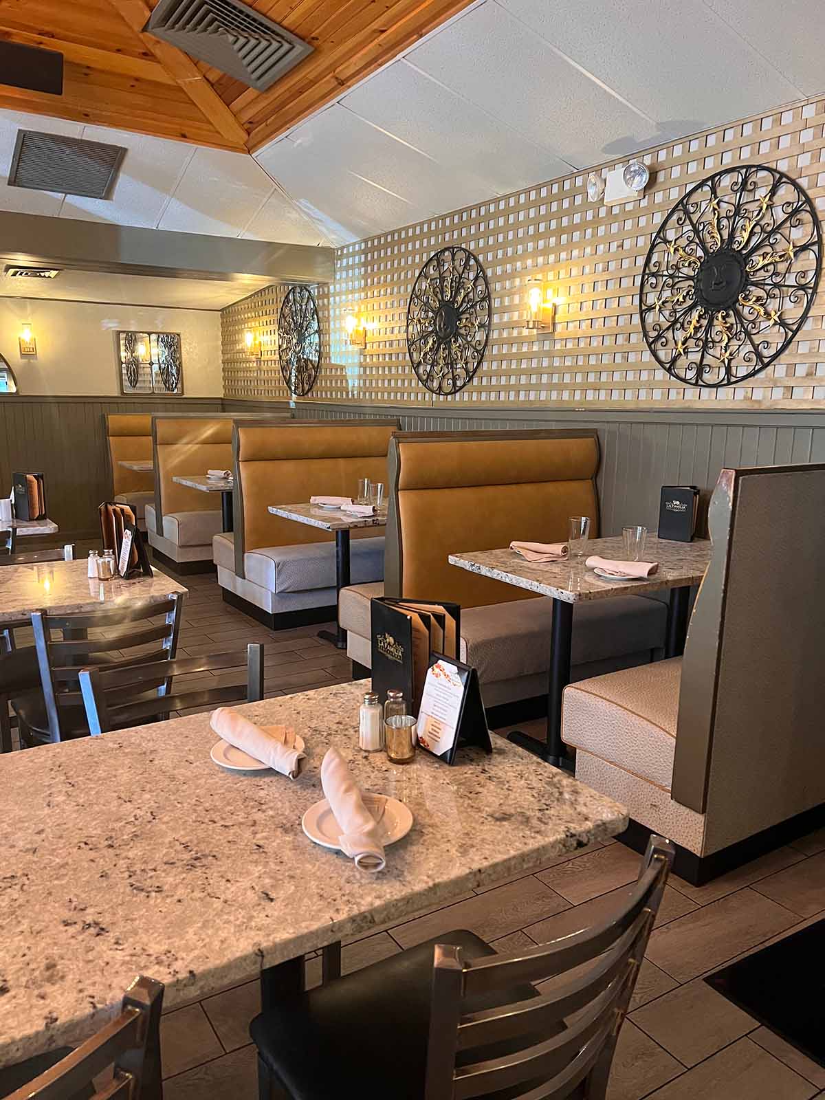 Dining room with booth seating and decorative wall art