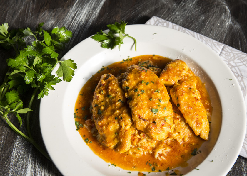 Pan-seared chicken in a citrus sauce with fresh parsley