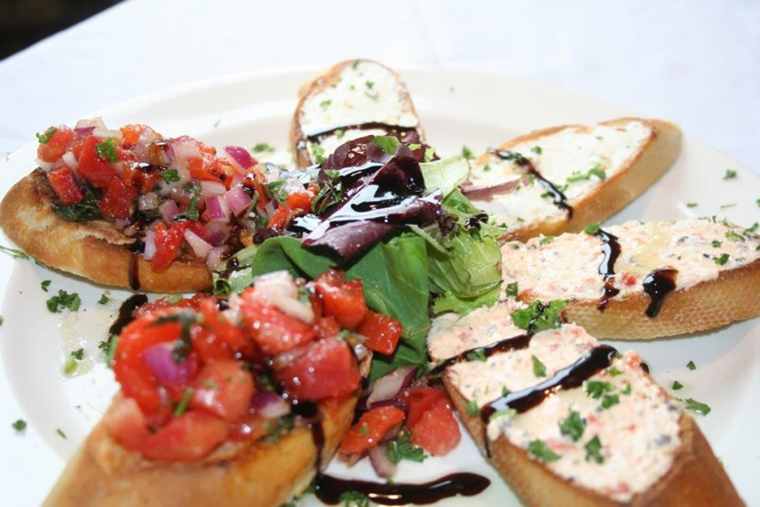 Platter of bruschetta with assorted toppings