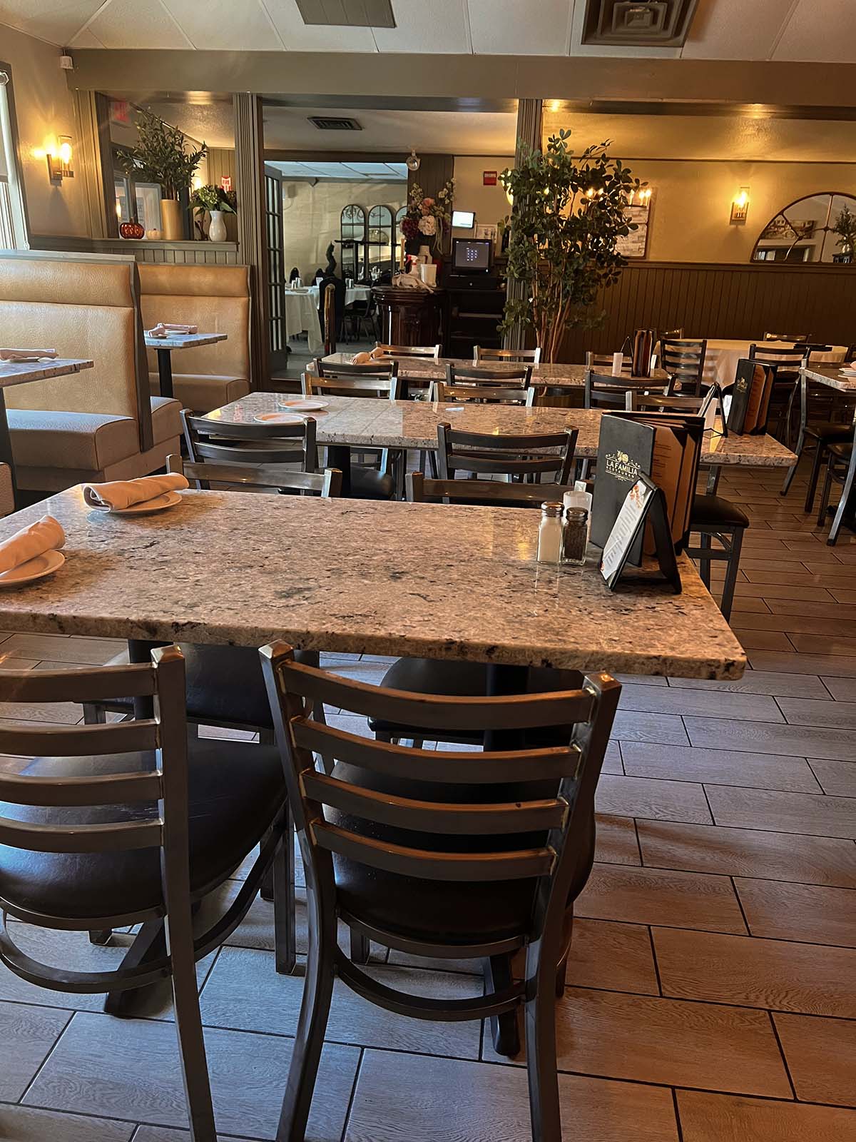 Dining room with granite-top tables and booth seating