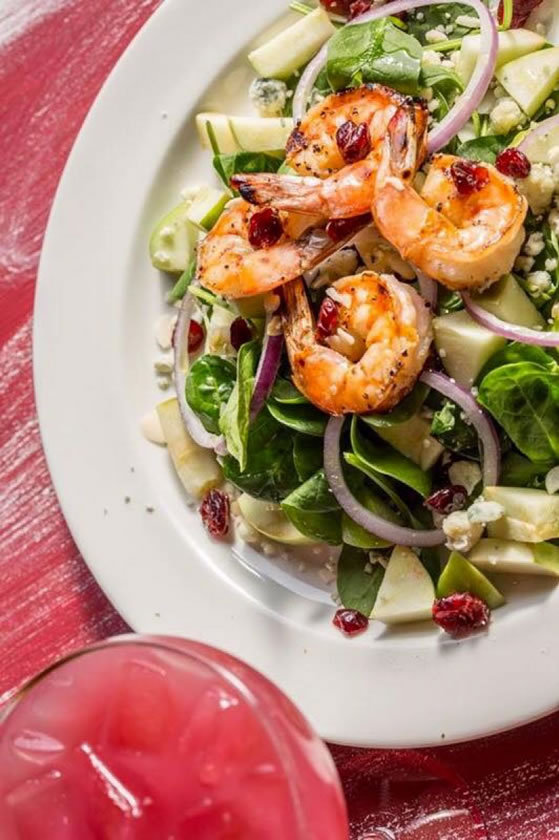 La Familia salad with grilled shrimp, spinach, cranberries and apples
