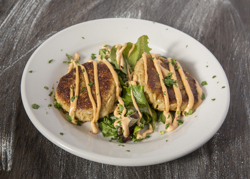 New England crab cakes with chipotle aioli and a side salad